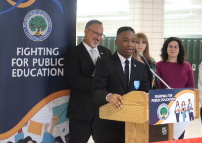 Sec Cardona pictured beyond Char Edwards