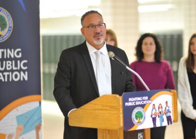 Secretary Cardona at the podium