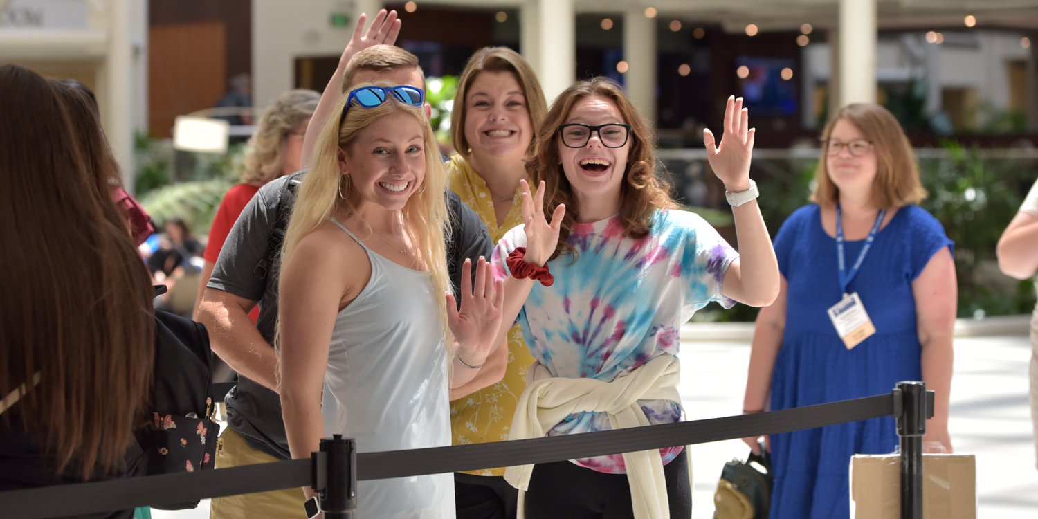 ConfDaily_RegistrationLine_Thursday Happy Students